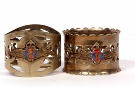Mixed Lot: two formerly electro-plated napkin rings of pierced circular form and both with applied