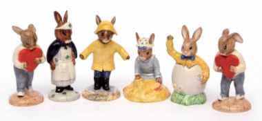 Group of six Bunnikins figures including Nurse Bunnikins, Rainy Day Bunnikins