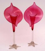 Pair of cranberry glass style jack in the pulpit vases on spreading feet