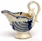 Late 18th century dolphin shaped pottery creamer, 9cms high