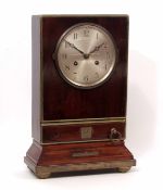 Composite walnut and brass bound mantel clock, the plinth shaped case fitted with a single drawer