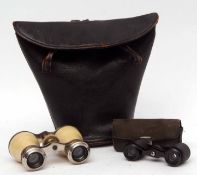 Two pairs of vintage opera glasses in a carrying case