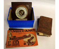 Two boxes containing vintage Bakelite earphones, a small music box, Meccano magazines, an oak