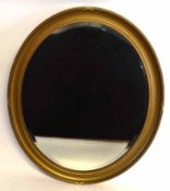 Gilt framed oval wall mirror, 89cms wide