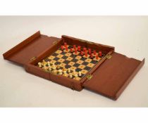 Mahogany framed folding travelling chess set with a set of stained bone chess pieces (one