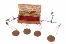 19th century German vellum covered cased steel and brass hand scales, together with a further second