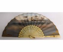 Late 19th century bone fan, with gilded and pierced sticks and the panel painted with pastoral scene