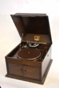 Oak cased HMV Model 103 wind-up record player with hinged and cushion moulded cover and chrome