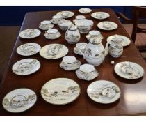 Japanese porcelain mid-20th century dinner service decorated with a landscape and mountainous scenes
