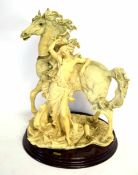 Large resin type figure of a maiden alongside a stallion on a wooden base with applied medallion "