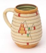Large Clarice Cliff Bizarre jug with geometric design on ribbed ground, 21cms high