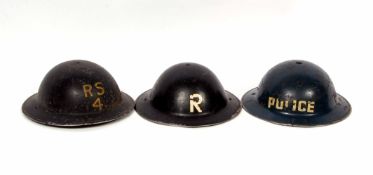 Mixed Lot: three various British painted steel helmets comprising Police, RFII, BBH 1939, R, ROCO