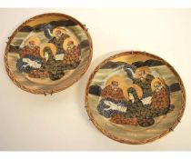 Two Japanese Satsuma plates decorated with immortals, 18cms diam