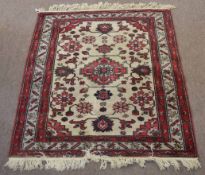 Small late 20th century Caucasian rug, central lozenge and floral designs, mainly red, grey and