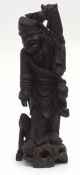 Oriental wooden carving, probably late 19th century, of an immortal or elderly figure holding a