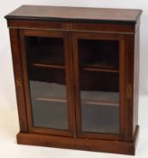 Victorian bookcase with two glazed doors enclosing fitted shelving, inlaid throughout with stringing