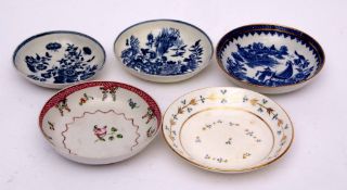 Group of 18th century English porcelain saucers including two Worcester saucers, a Caughley saucer