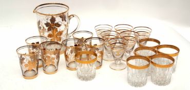 Collection of glass wares with gilt rims comprising water jug and quantity of various sized glasses