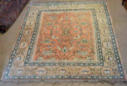 Late 20th century faded Caucasian carpet, central panel of twining foliage on a rust field within