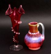 Glass cranberry glass ewer with green ribbed decoration together with a glass vase with trailing