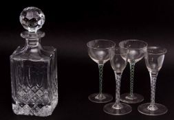 Cut glass decanter and stopper with two small air twist wine glasses and a further two glasses