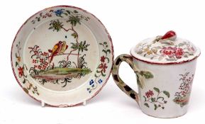 French Rouen faience chocolate cup and cover with stand, decorated with a bird design, the cover