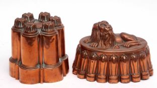 Two jelly moulds, one with a lion design