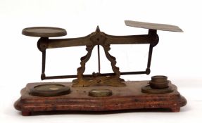 Late 19th century postal scale, the serpentine shaped base set with a pierced frame with shaped pans