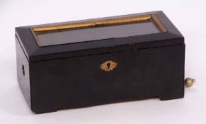 Late 19th century Swiss black painted single tune music box, the hinged and glazed cover with