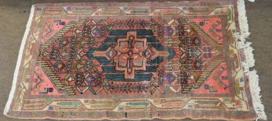 Small late 20th century Caucasian prayer rug, central geometric lozenge with green detail on a