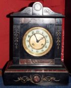 Late 19th century black and variegated rouge marble mantel clock, the plinth shaped case with shaped