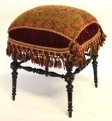 Late 19th century ebonised framed foot stool with petit point wool upholstered seat, 46cms wide