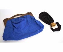 Two vintage handbags one with an oak handle and blue lining, the other with a brass extendable