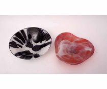 Two Studio Glass bowls with stylised designs, one with a smoky white design on red ground, the other