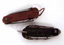 Mixed Lot: two various Government issue clasp knives, the first with red composite grips, NKF, 1942,