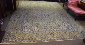English wool carpet, multi-gulled border, central panel of trailing floral designs, mainly pale