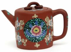 Chinese red ware pottery tea pot decorated with an anglaise enamel design with seal mark to base,