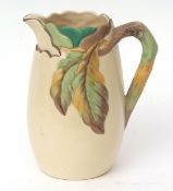 Large Clarice Cliff cream coloured jug with moulded leaf pattern, 24cms high