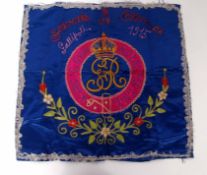 First War period embroidered cushion cover bearing the badge of The Kings Own Royal Regiment and