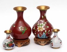 Pair of baluster vases with enamelled decoration, together with two smaller cloisonne vases, the