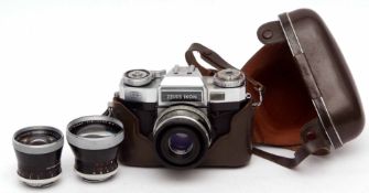 Mixed Lot: Zeiss Ikon SLR camera together with cased wide-angle and telephoto interchangeable lenses