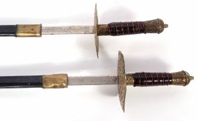 Two 20th century brass mounted Indian ceremonial swords, each with etched blades marked "Made in