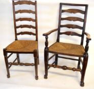 Set of five Lancashire style ladder back dining chairs with rush seats, comprising one carver and