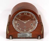 First half of 20th century triple barrel mantel clock, the mahogany and cross-banded arched case