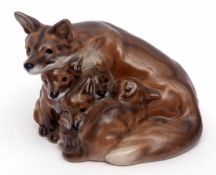 Royal Copenhagen model of a vixen with cubs in a brownish purple glaze