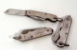 Mixed Lot: three various stainless steel Government issue clasp knives including 1946, 1952 and