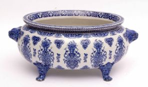 Large 19th century bowl with lion mask handles and underglaze blue floral design, 36cms diam