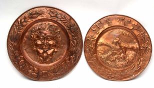 Large copper circular wall plaque, centre impressed with a mythical mask within a border of