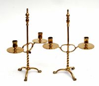 Pair of brass candleholders on tripod paw feet