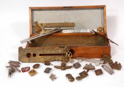 Mixed Lot: plain pine glove box containing mixed cap badges, pips, buttons and medal brooches (qty)